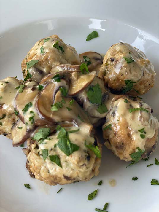 Chicken Meatballs with Mushrooms in a white plate