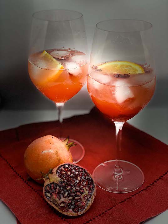 Pomegranate Aperol Spritz on a red napkin