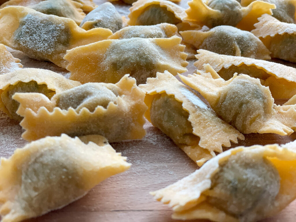 Agnolotti on a wooden board