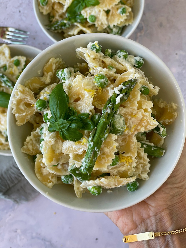 Ricotta Asparagus Pea Pasta in a white bowl