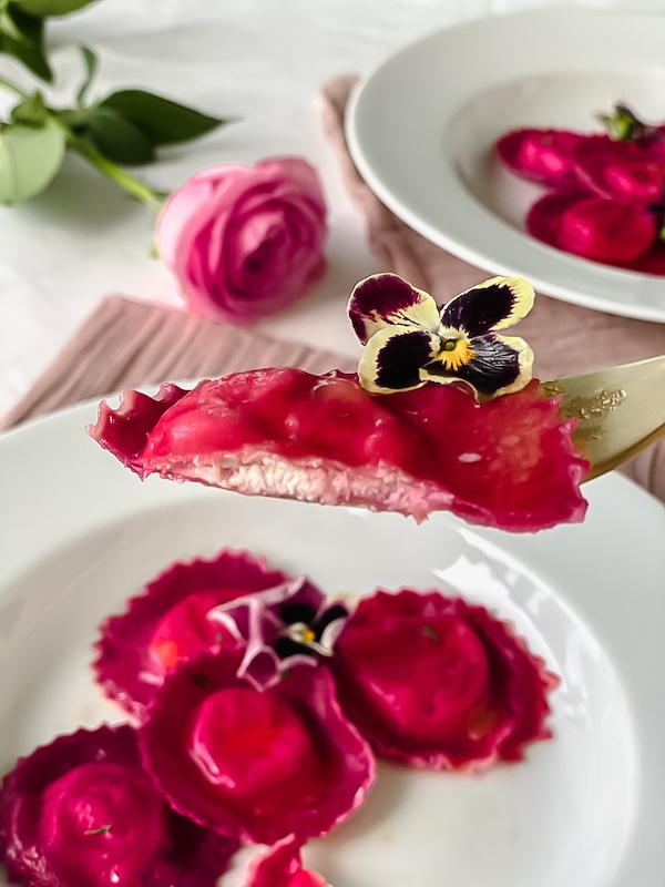 Beetroot ravioli filled with goat cheese.