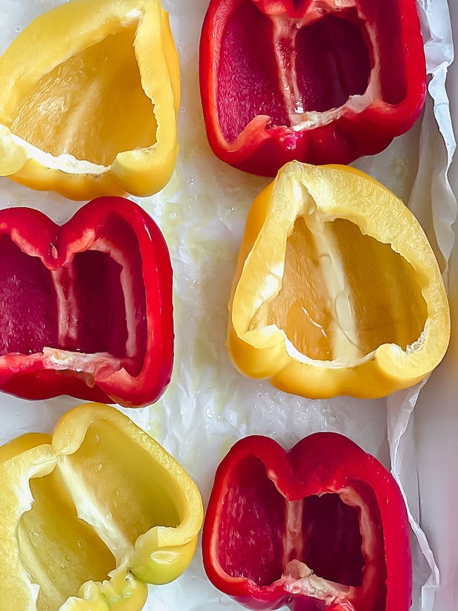 Peppers halved before roasting