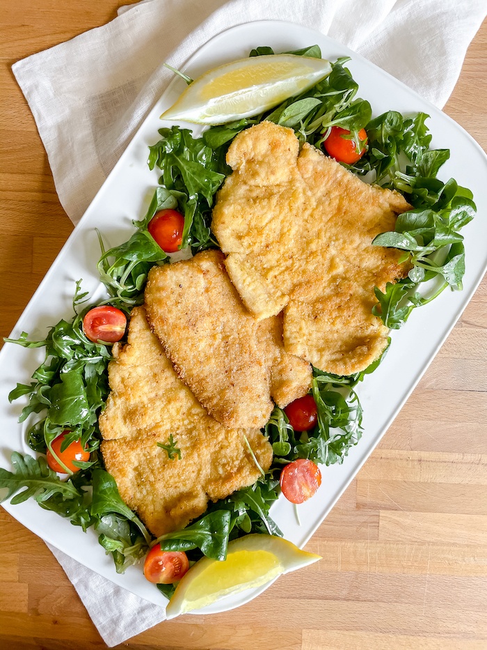 Final chicken cutlets on serving plate