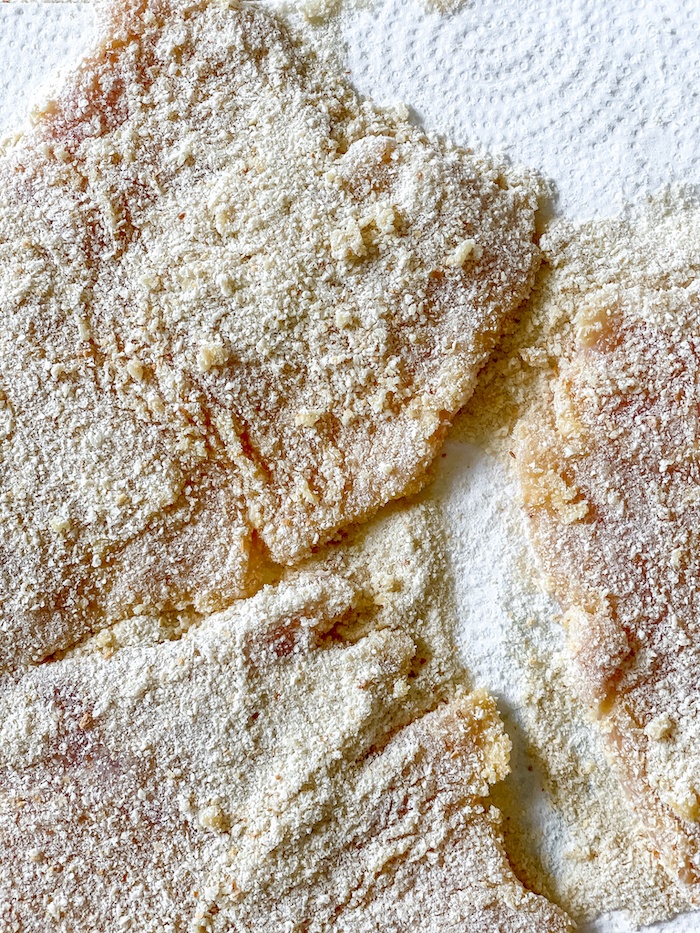 dredging chicken-cutlets in-breadcrumbs_