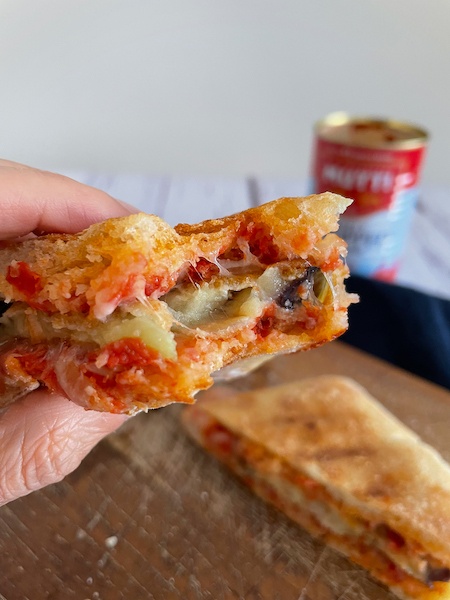 Caramelized Tomato Panini in one hand