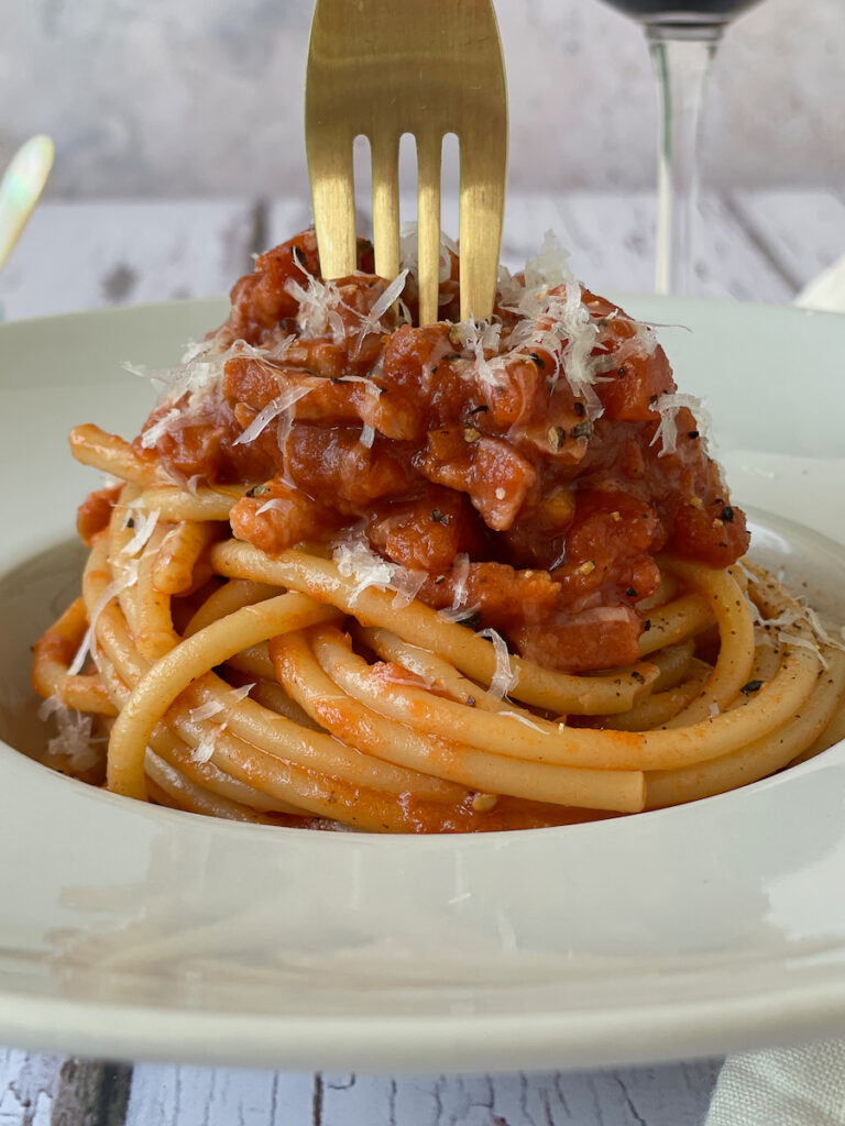 Gold fork twirling Pasta all'Amatriciana