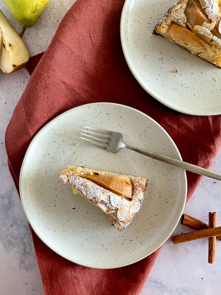 2 white plates with slices of Italian Pear Cake