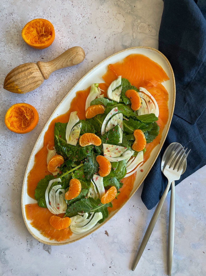 Smoked Salmon Fennel Mandarin Salad on a white oval plate
