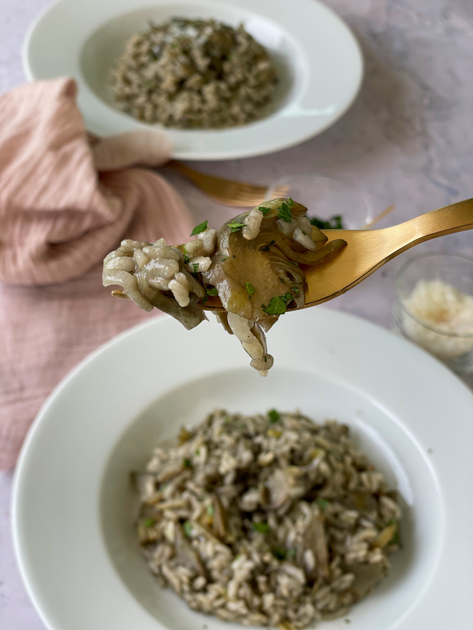Creamy artichoke risotto bite on a fork