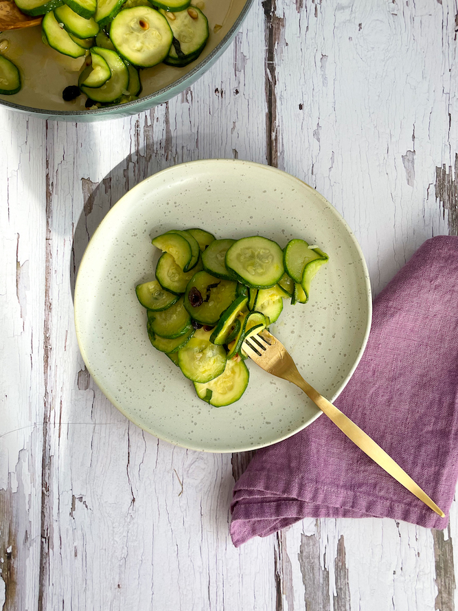 Zucchini on a white speckled plate