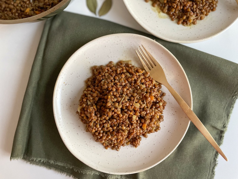 Plate of Italian lentils on a green napkin