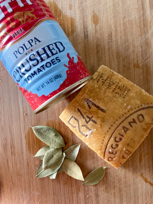 Tomato crushed and Parmesan rind.