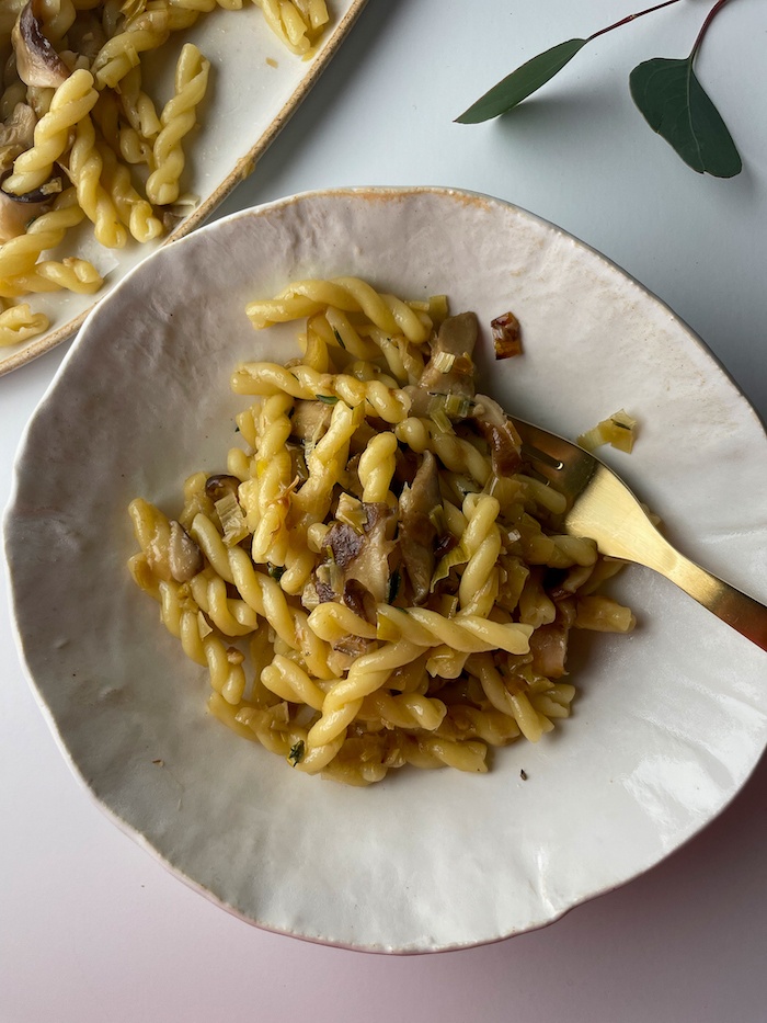 gemelli pasta on a plate with fork