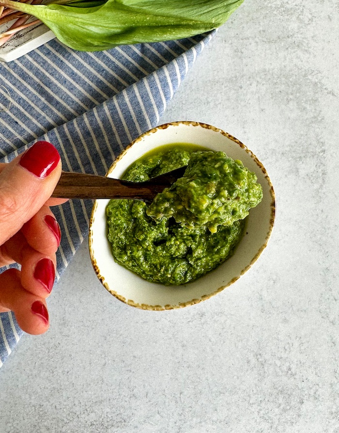 wild ramp pesto on a wooden spoon