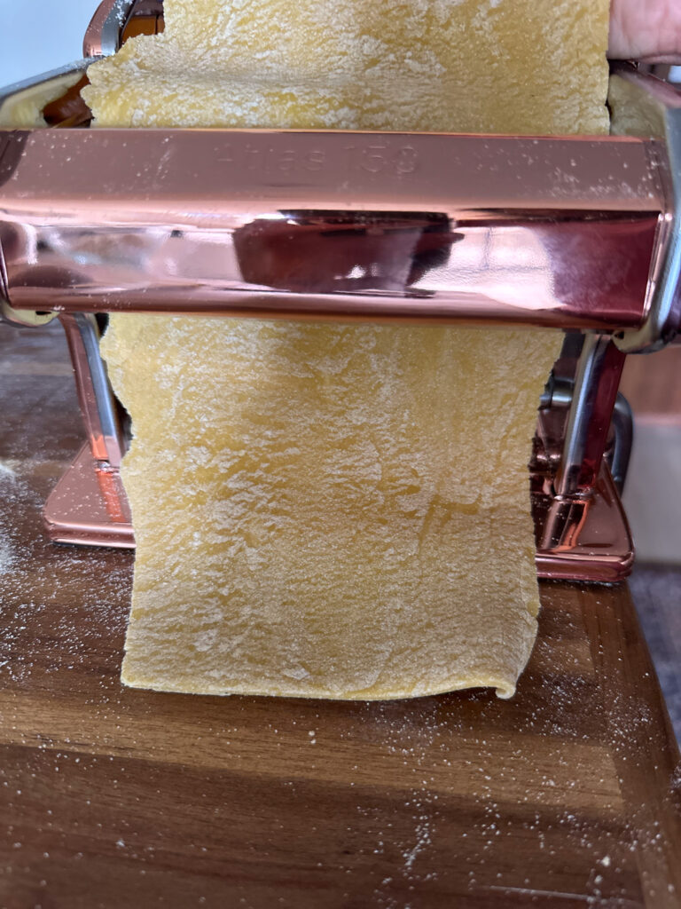rolling pasta with a pasta machine