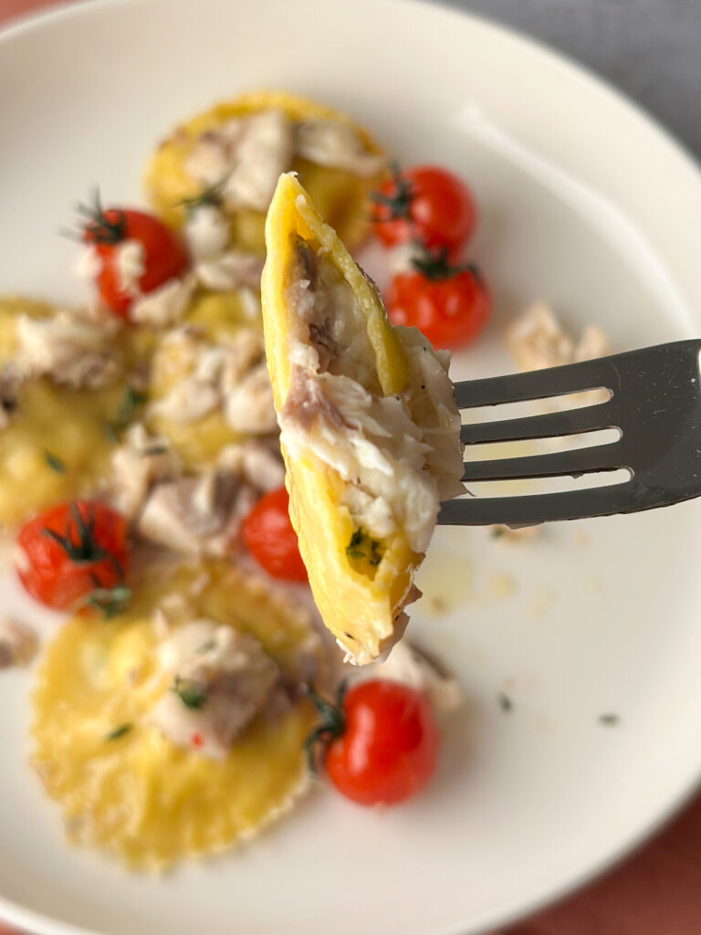 Sea Bass Raviolo Bite on a fork