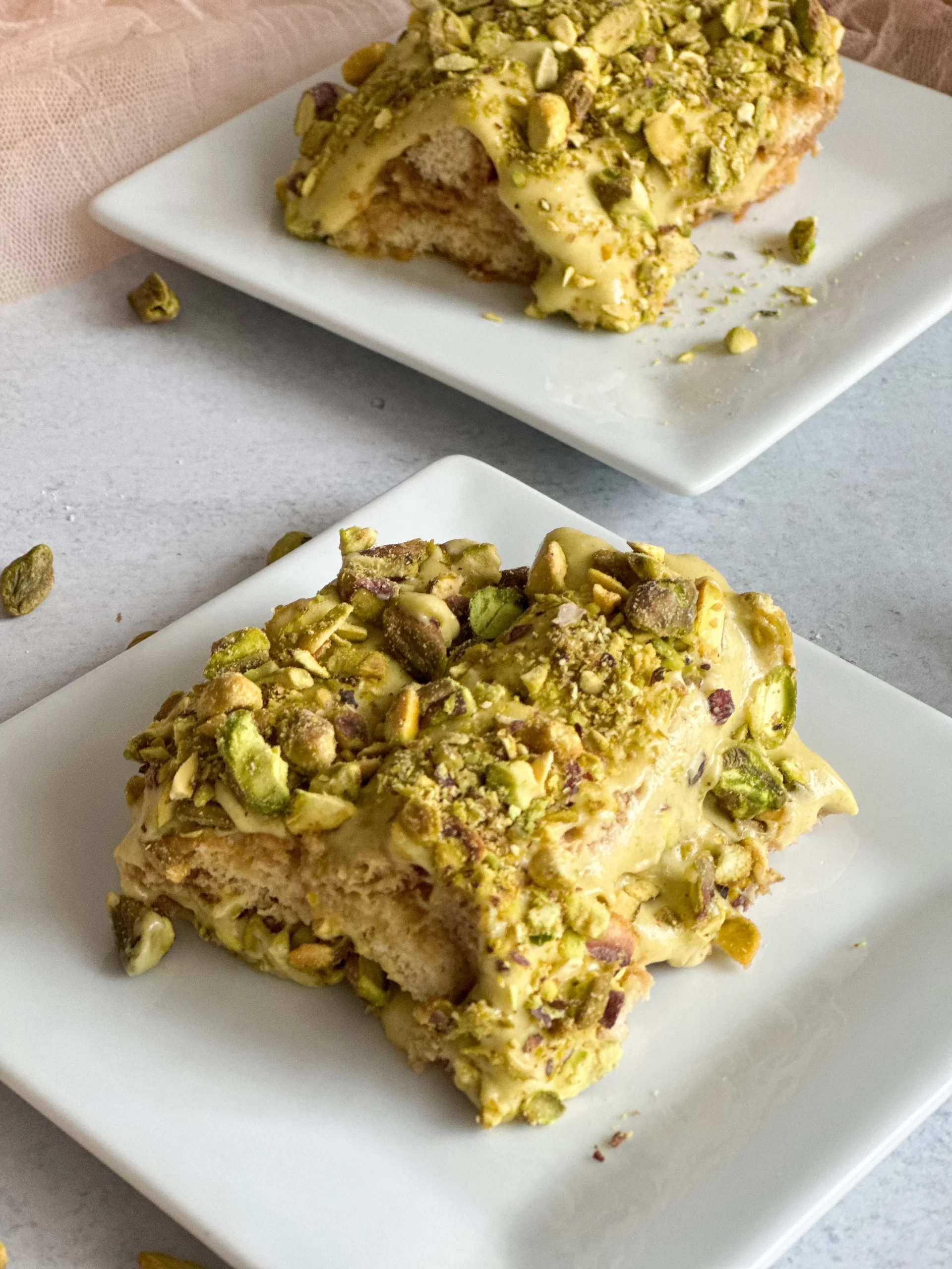 Pistachio Tiramisu in 2 plates angle view