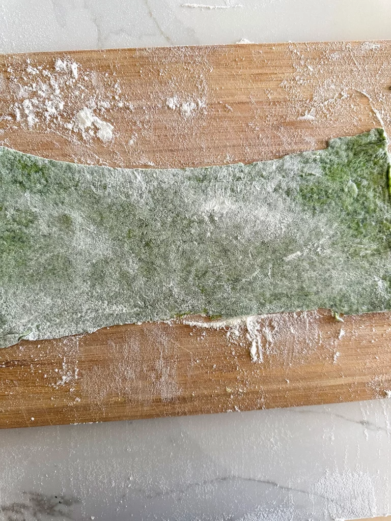 Rolled out green pasta dough