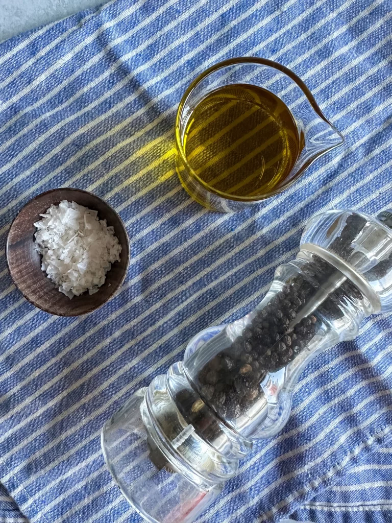 Caprese Salad Dressing ingredients: extra virgin olive oil, salt and pepper.