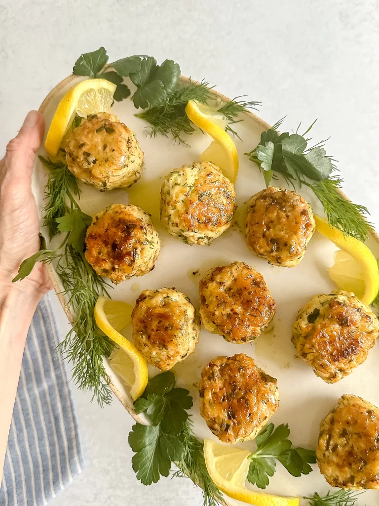 Tray full of chicken meatballs in hands
