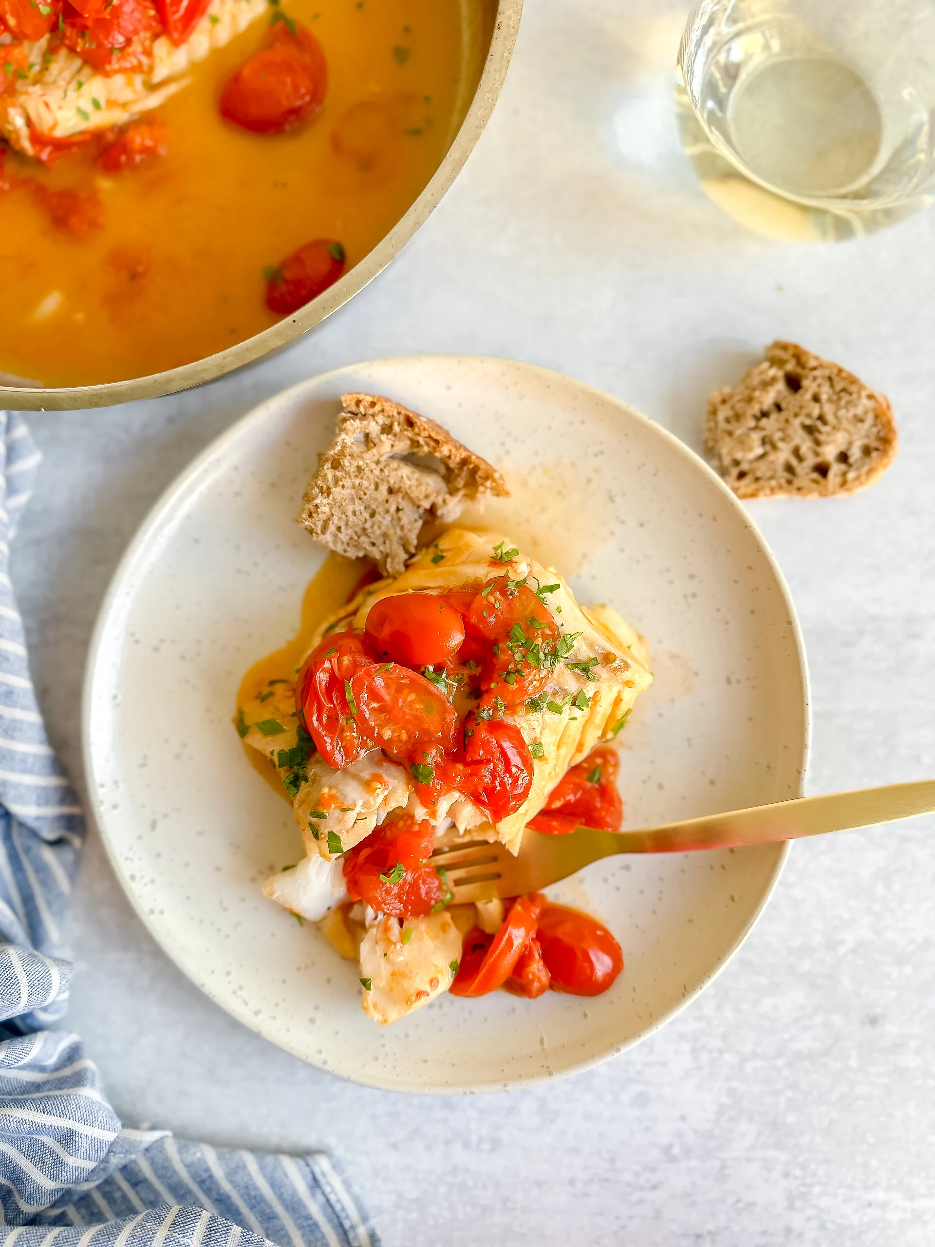 Acqua Pazza- Italian Poached Fish in a plate with bread