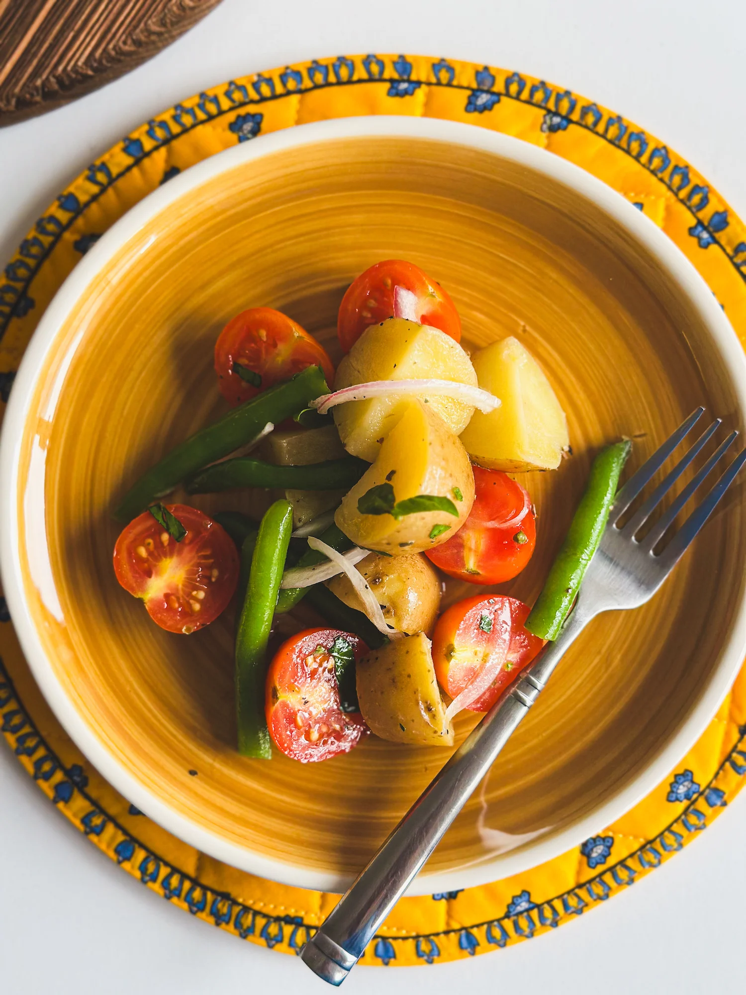 Italian Potato Salad on a yellow plate