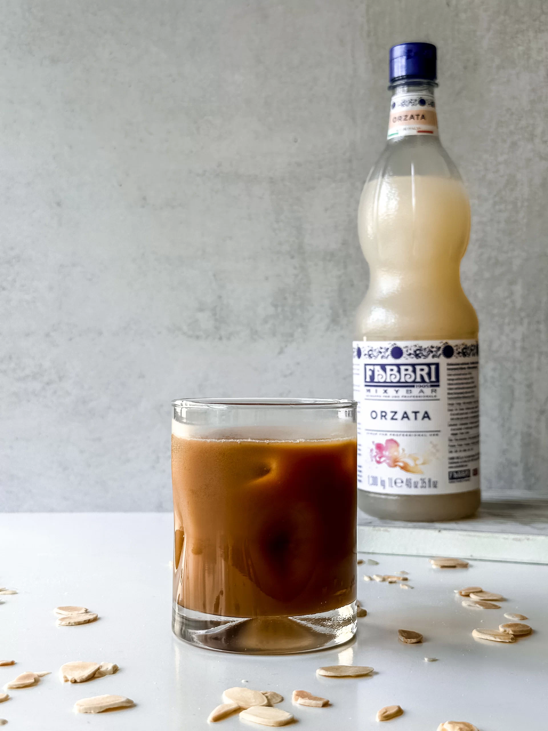 Iced coffee with Orgeat Syrup in a glass