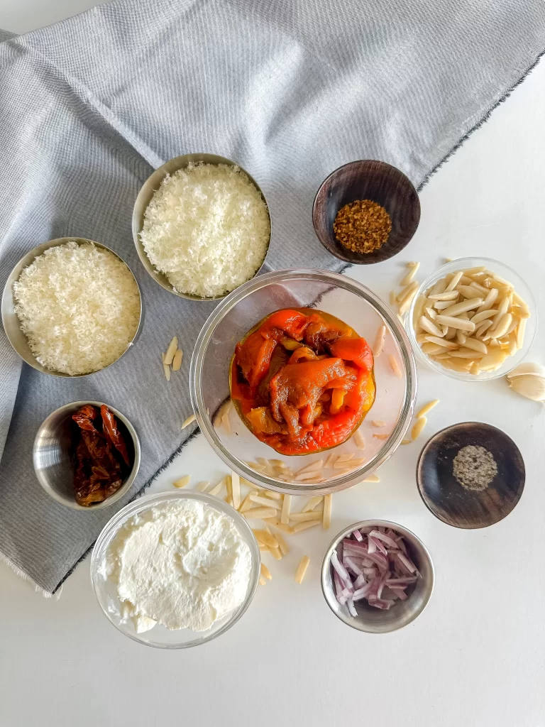 Ingredients to make roasted bell pepper pesto.