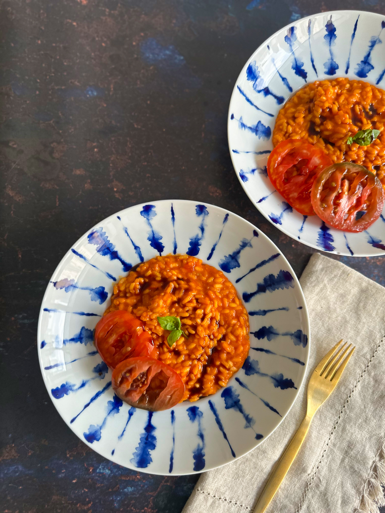 2 plates of creamy tomato risotto