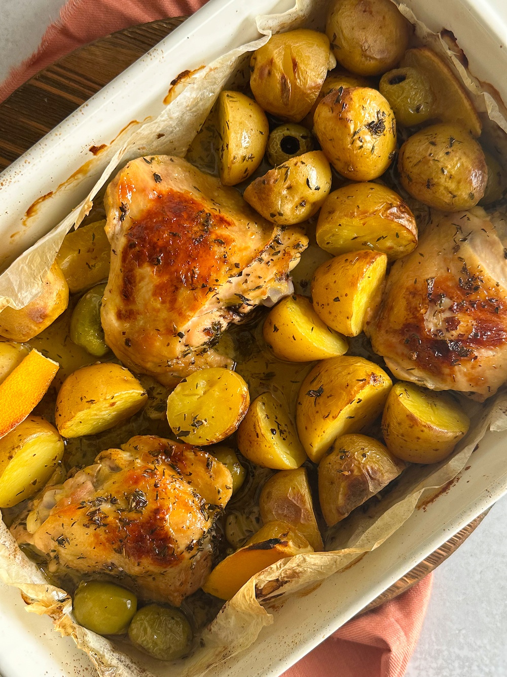 Juicy roasted chicken thighs with crispy potatoes