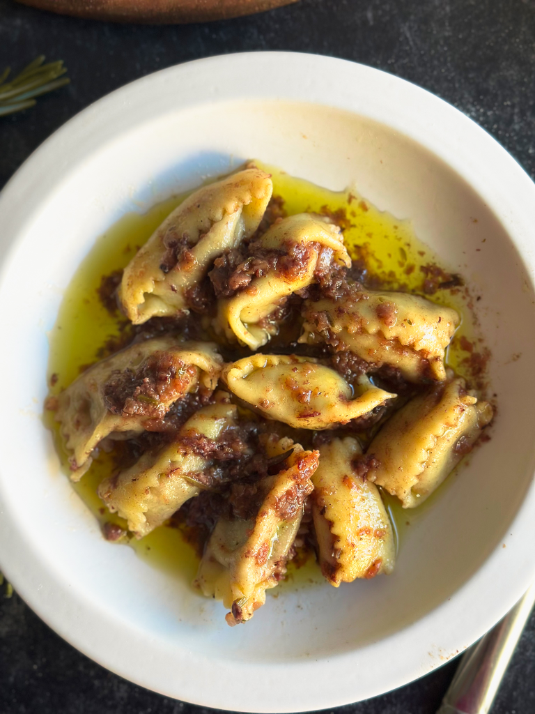 Agnolotti al Brasato on a white plate