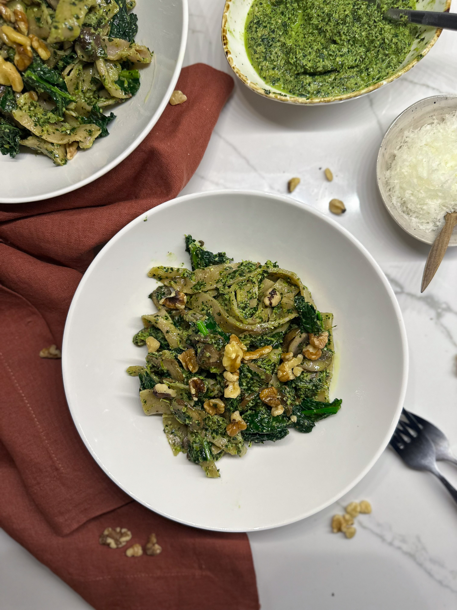 Spelt Tagliatelle Pasta with Kale Walnut Pesto in plates