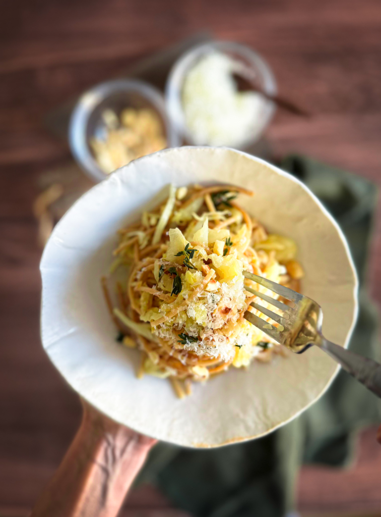 Fork twirling the cabbage pasta