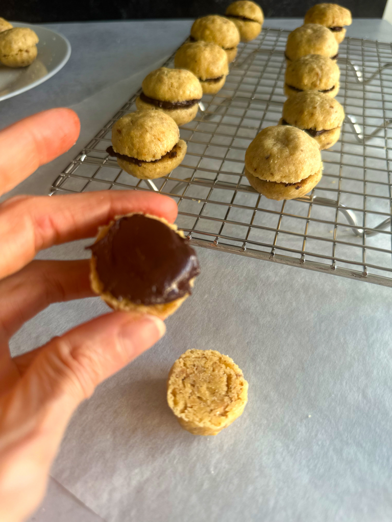 chocolate spread over half cookie