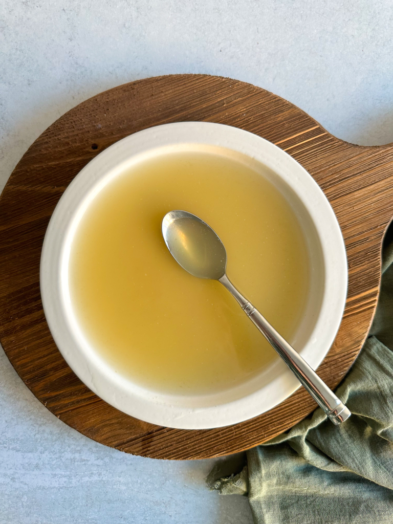 Traditional Italian chicken broth strained and golden