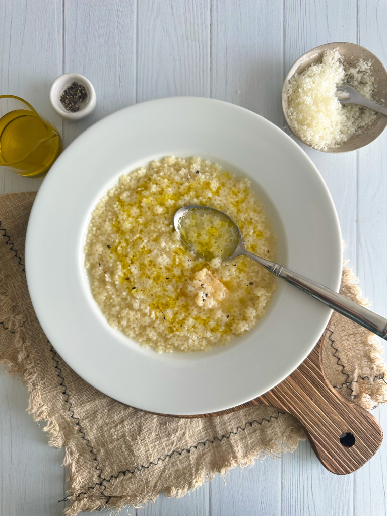 Italian Penicillin soup in a plate with a spoon