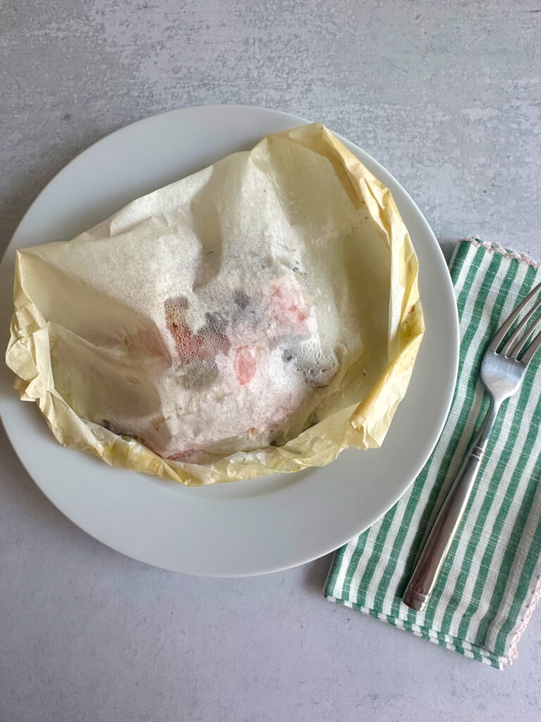 sealing the parchment paper by crimping the edges