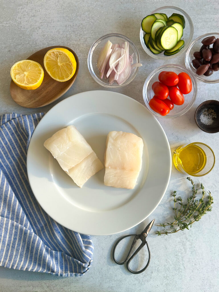 Ingredients to make fish in parchment paper.